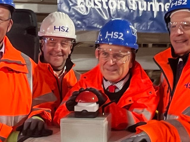 <p>Red to go: Mark Wild, chief executive of HS2 (left) and rail minister Lord Hendy at the ceremony to begin the last stretch of tunnelling to London Euston</p>