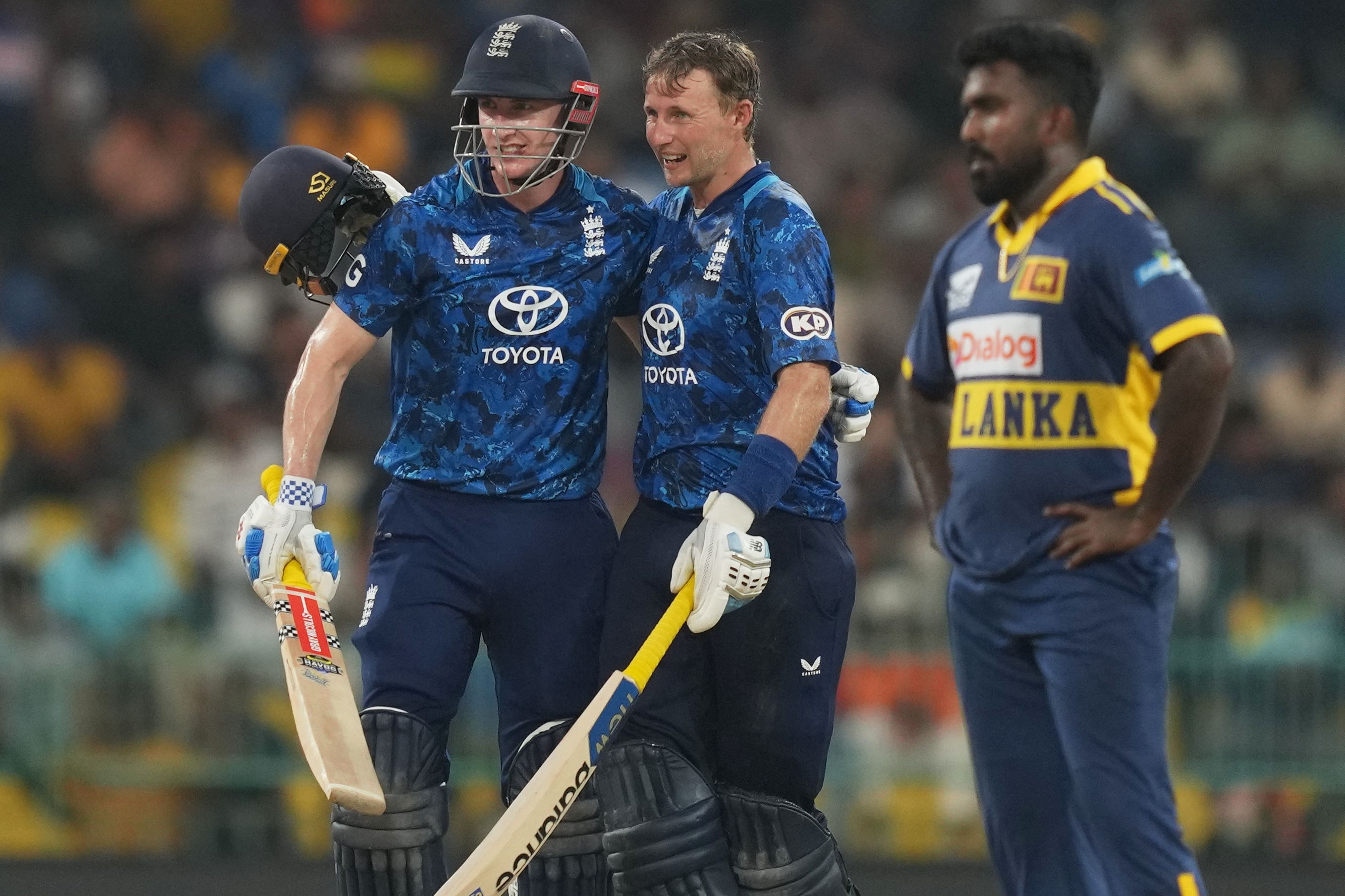 Harry Brook, left, and Joe Root shared a sensational partnership (Eranga Jayawardena/AP)