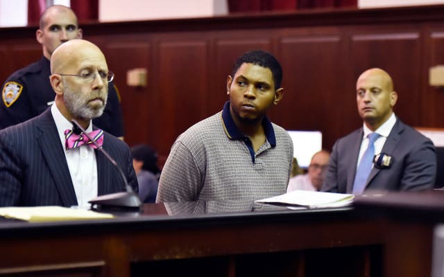 <p>Randy Santos, center, is arraigned in criminal court for the murder of four homeless men, Oct. 6, 2019, in New York. (Rashid Umar Abbasi/New York Post via AP, Pool)</p>