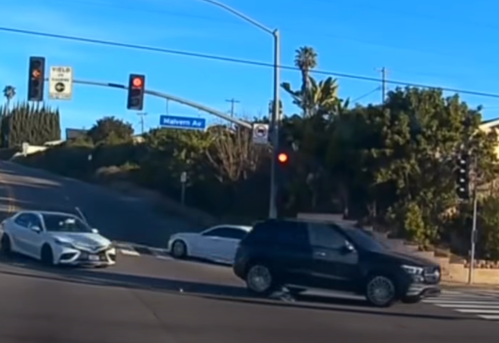 Video footage shared online showed a black SUV driving into an intersection in Fullerton County when the passenger side door opens and the child falls out into the road