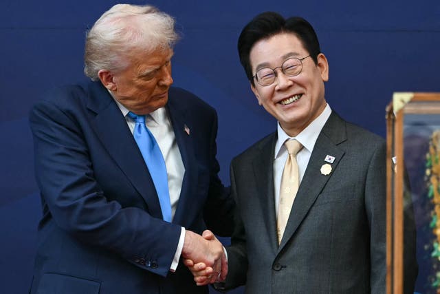 <p> US President Donald Trump shakes hands with South Korean President Lee Jae Myung during a high honor presentation ceremony at the Gyeongju National Museum in Gyeongju </p>