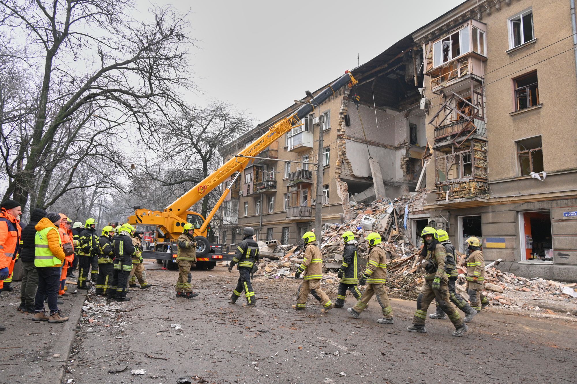 Rescue workers clear the rubble of a residential building which was damaged after a Russian strike in Odesa, Ukraine, Tuesday, Jan. 27, 2026