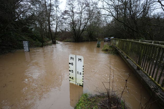 A river ford under several feet of water at Houndsfield Lane in Birmingham on Tuesday (Jacob King/PA)