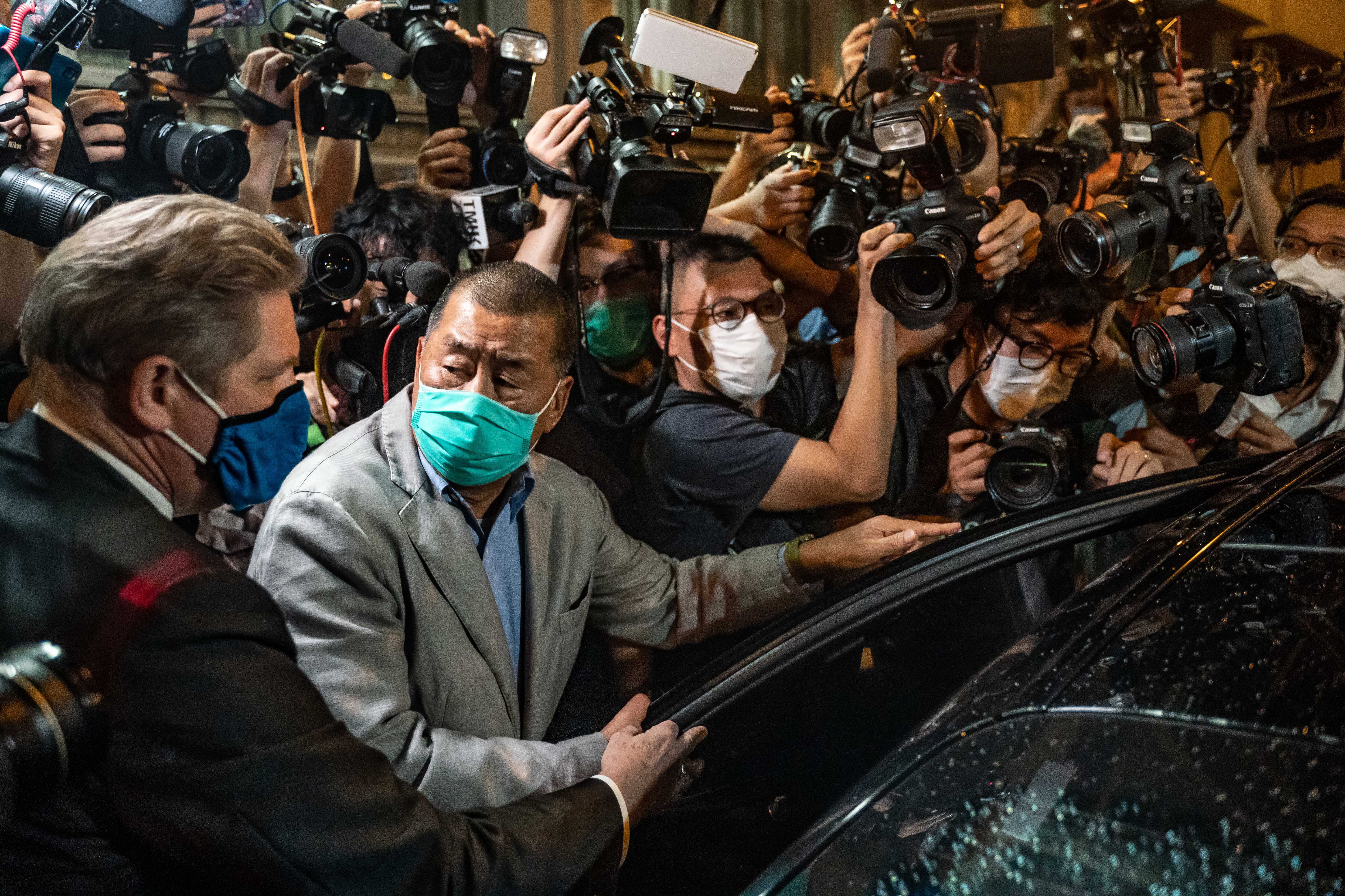 <p>Apple Daily founder Jimmy Lai leaves a Hong Kong police station on 12 August 2020</p>