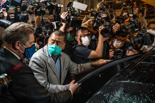 <p>Apple Daily founder Jimmy Lai leaves a Hong Kong police station on 12 August 2020</p>