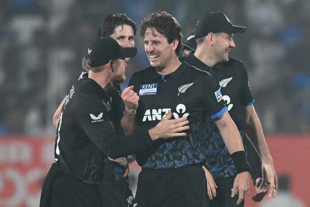 <p>Matt Henry (centre) celebrates after taking the wicket of Shivam Dube</p>