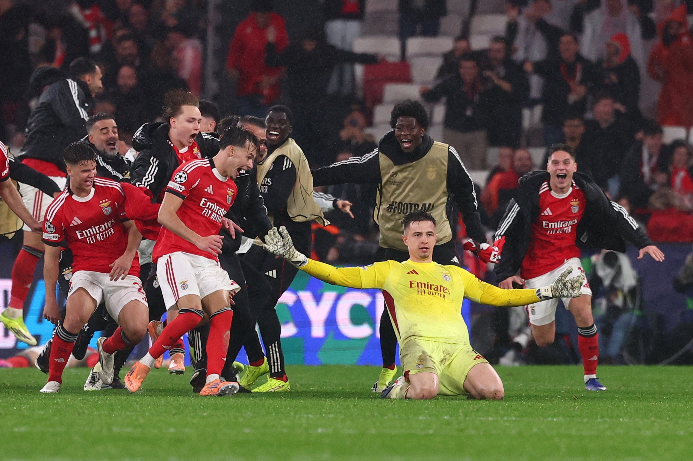 <p>Benfica's Anatoliy Trubin celebrates scoring their fourth goal and sending them into the play off round</p>