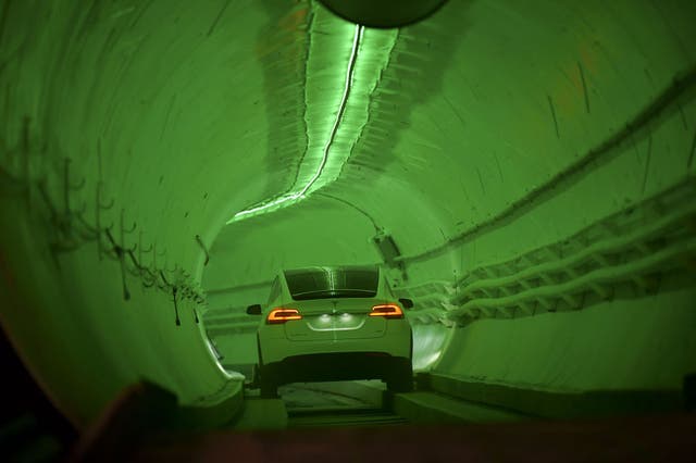 <p>A Tesla Model X drives into the tunnel entrance in Hawthorne, south of Los Angeles </p>