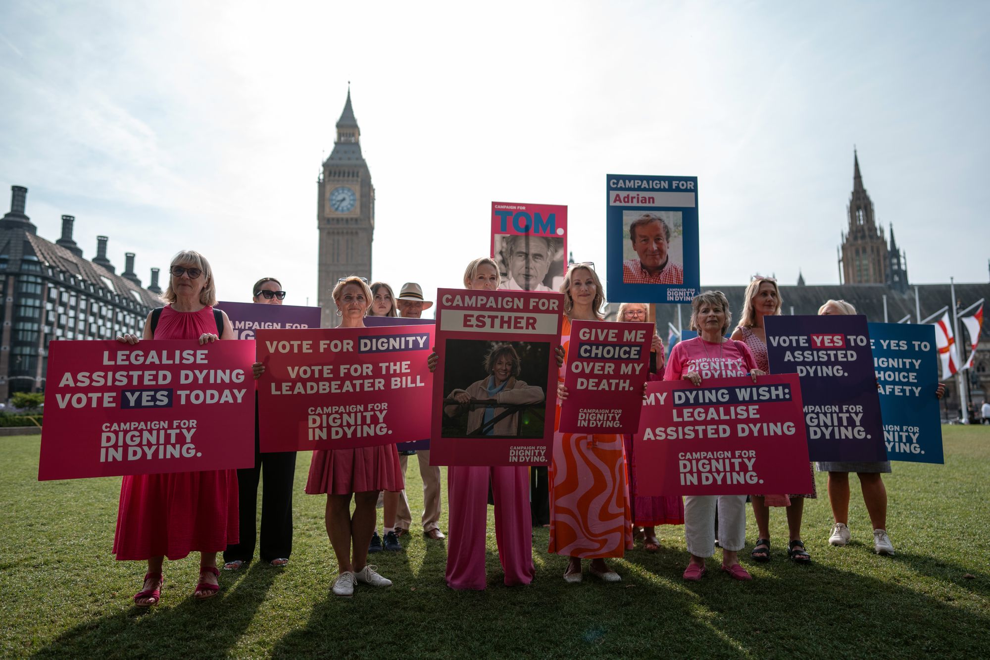 Pro-assisted dying campaigners hold placards as they protest ahead of a Commons vote on the bill in January