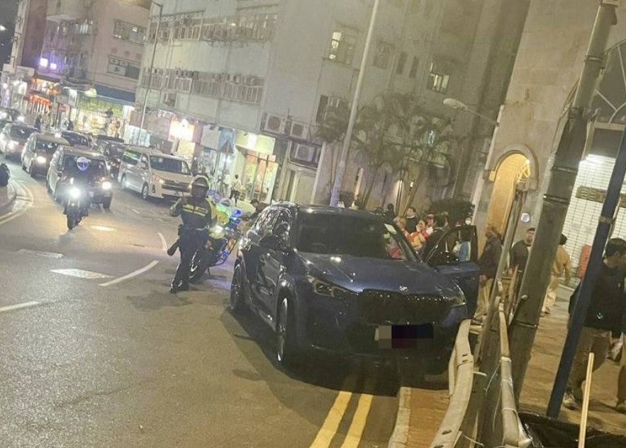 <p>A 11-year-old child in Hong Kong steers car for nearly 100 metres after father falls unconscious behind the wheel in Kennedy Town, Hong Kong</p>