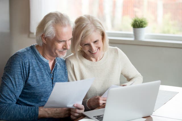 <p>A retired couple looking through bank statements together</p>