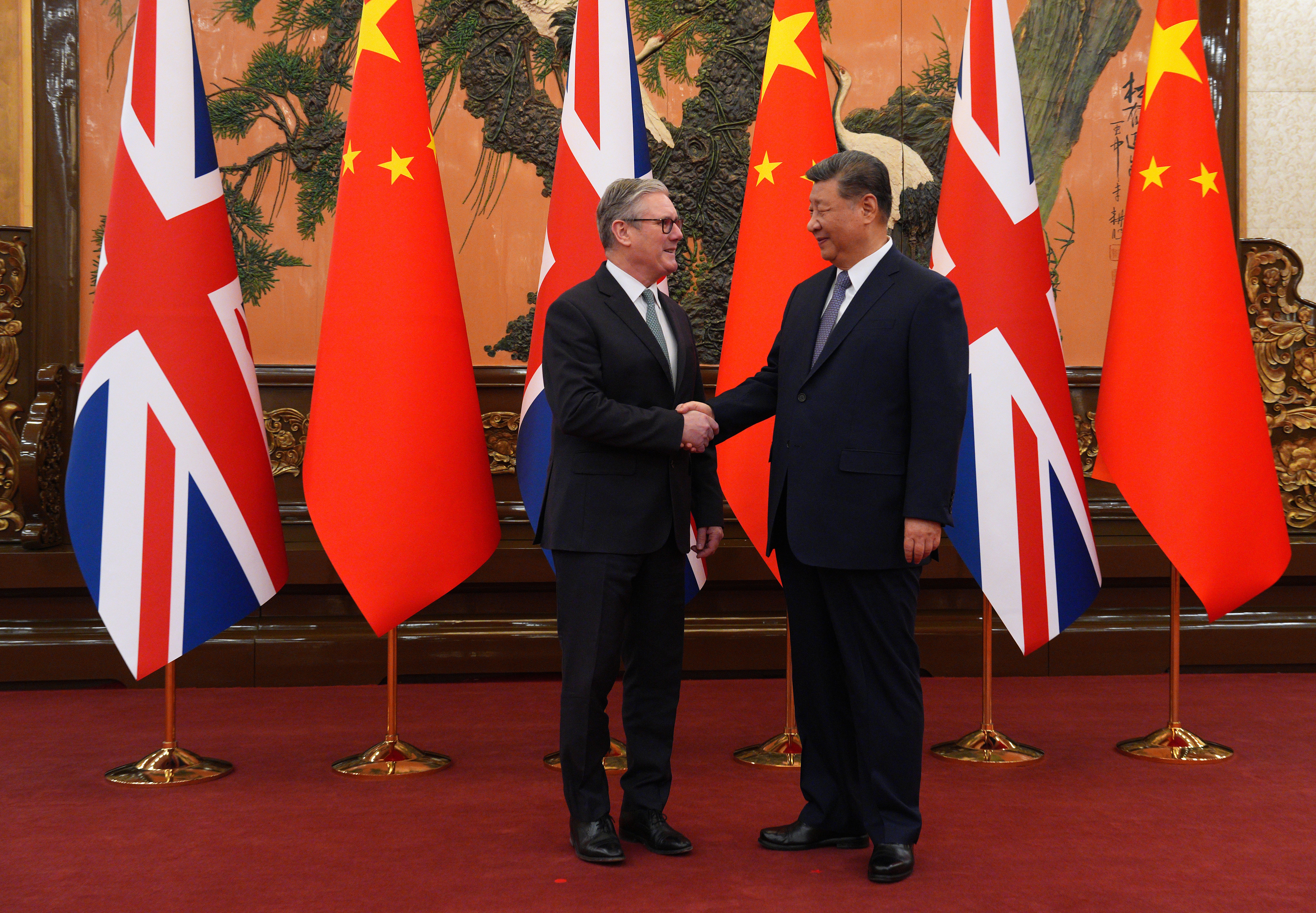 Prime minister Sir Keir Starmer shakes hands with president Xi Jinping