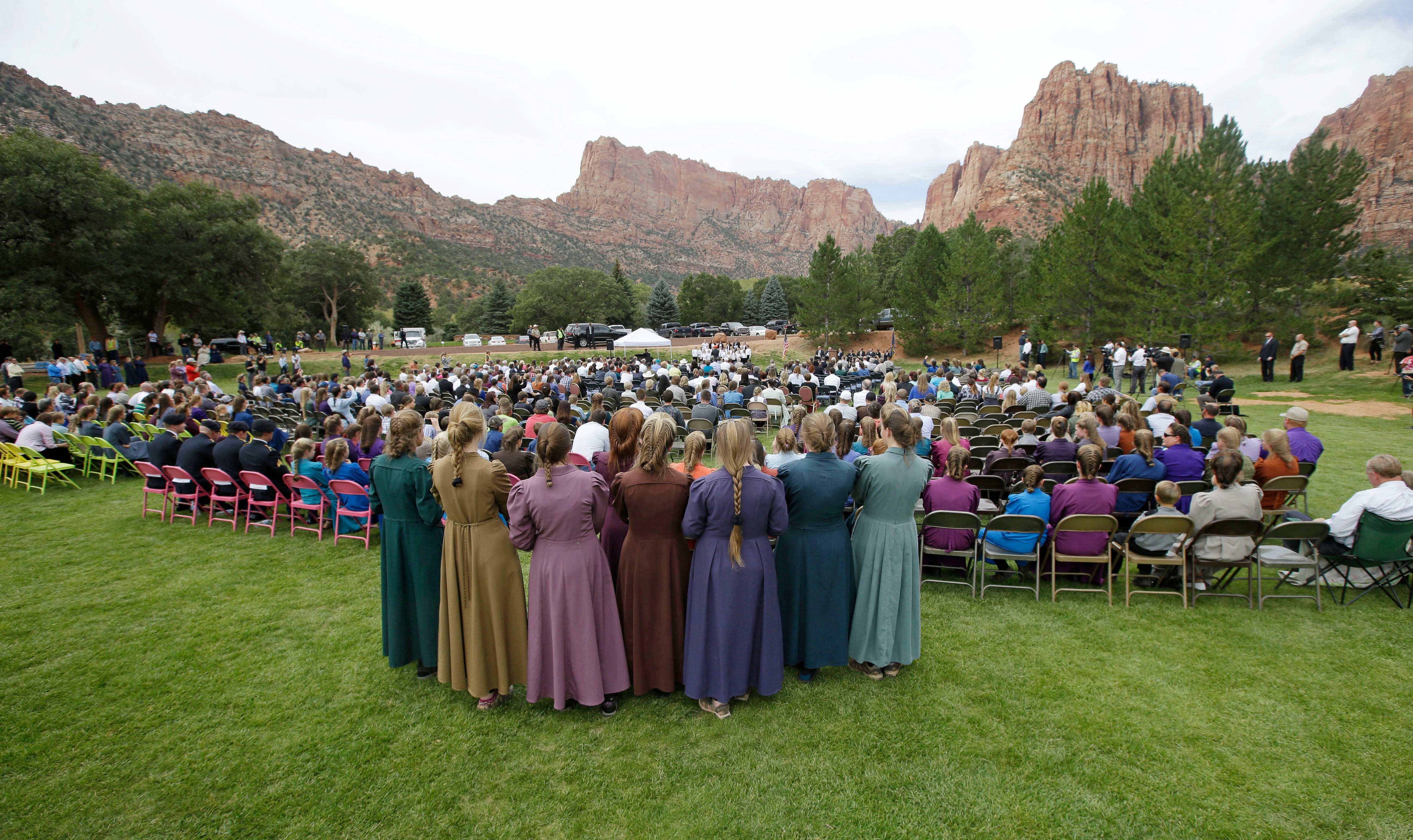 <p>Two polygamous towns on the Utah-Arizona border hold a public memorial for women and children swept away in a deadly flash flood</p>