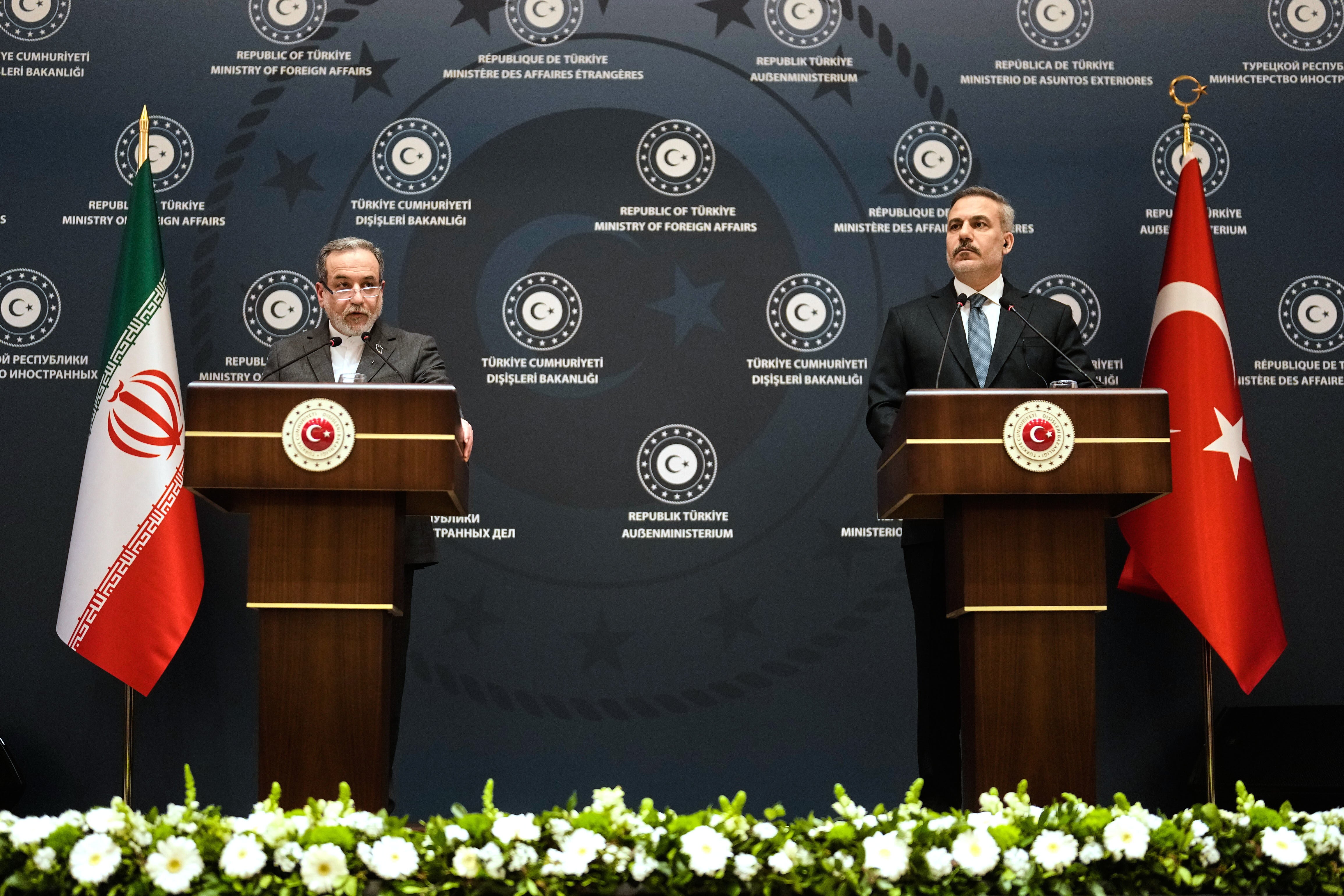 Turkish Foreign Minister Hakan Fidan, right, and his Iranian counterpart Abbas Araghchi hold a joint press conference in Istanbul