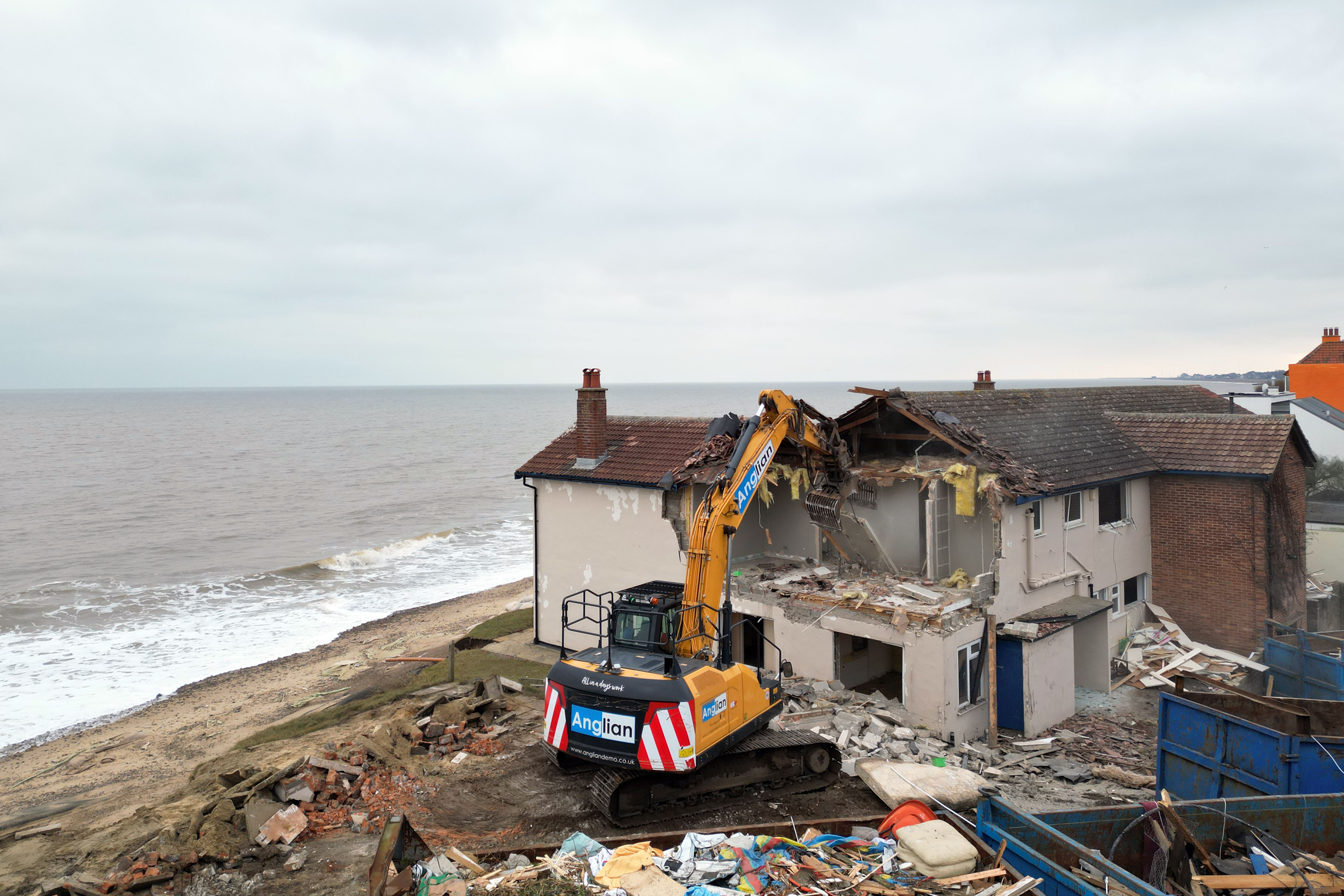 A property is demolished on the clifftop at Thorpeness, Suffolk (Joe Giddens/PA)