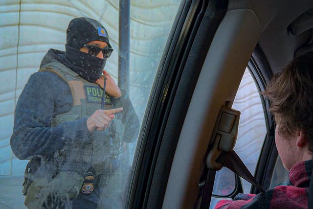 <p>An ICE agent threatens a volunteer with arrest if they keep following his car amid a violent crackdown in Minneapolis </p>