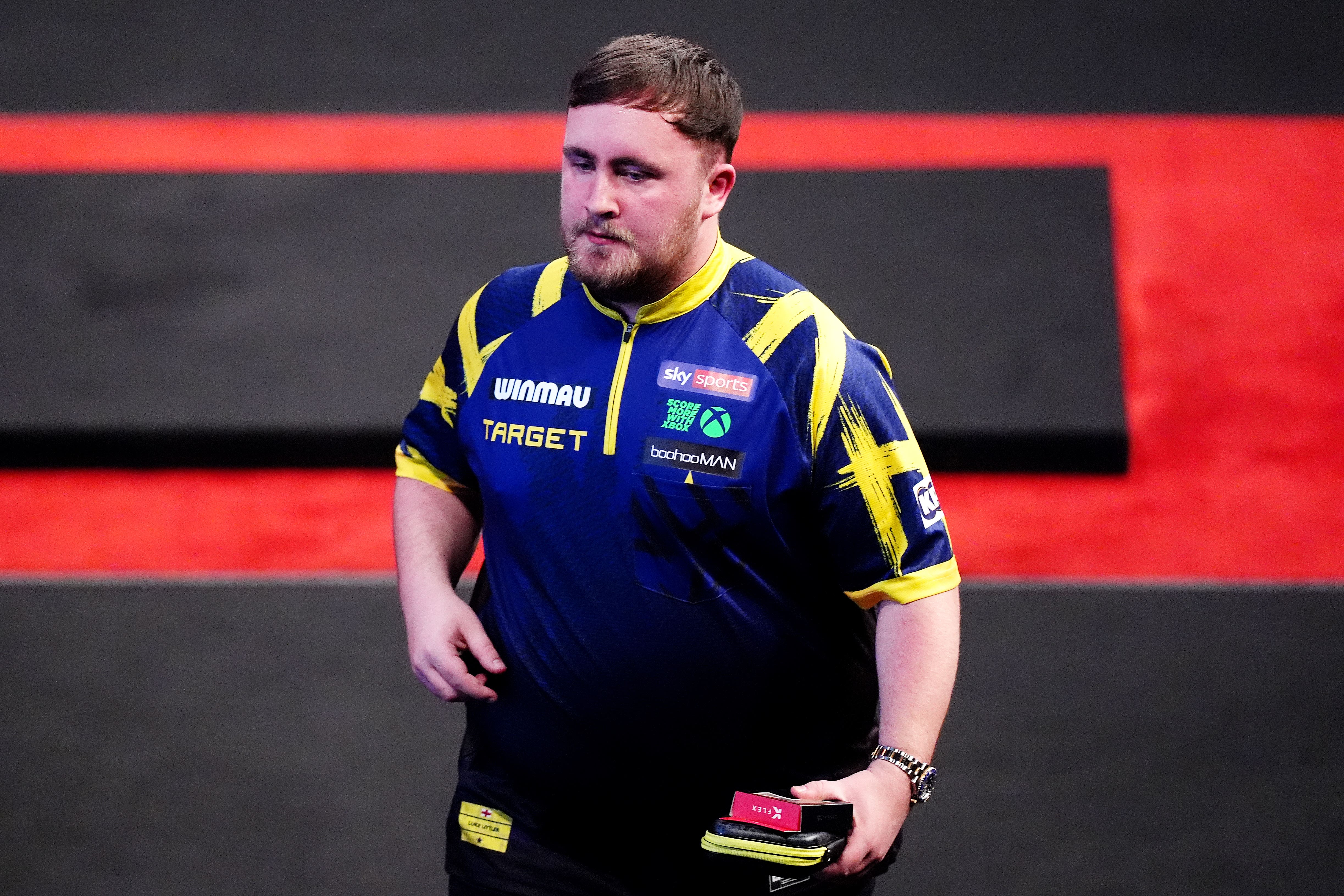 Luke Littler edged through in Milton Keynes (John Walton/PA)