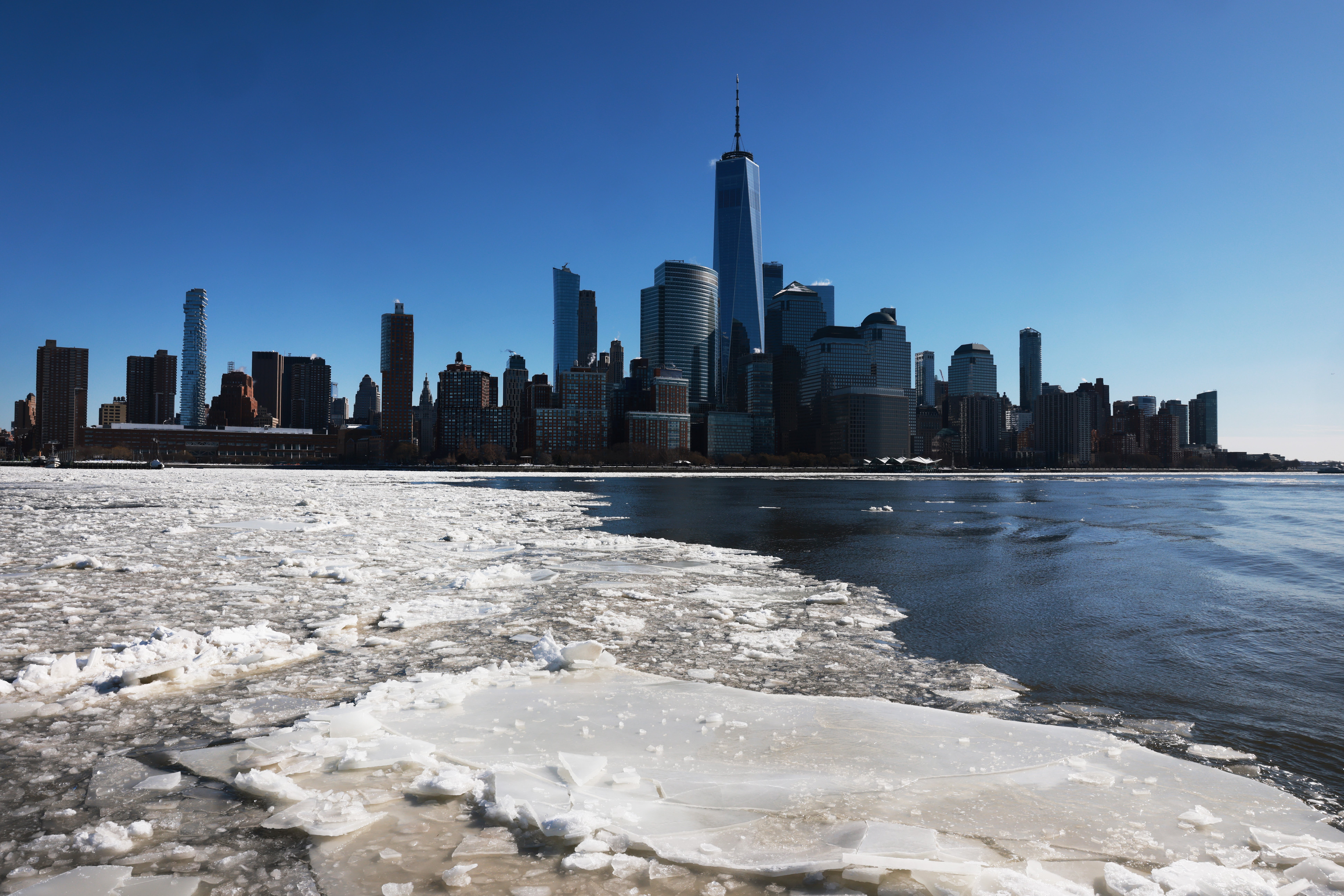 Ice floats cover part of the Hudson River along the Manhattan shoreline of New York City