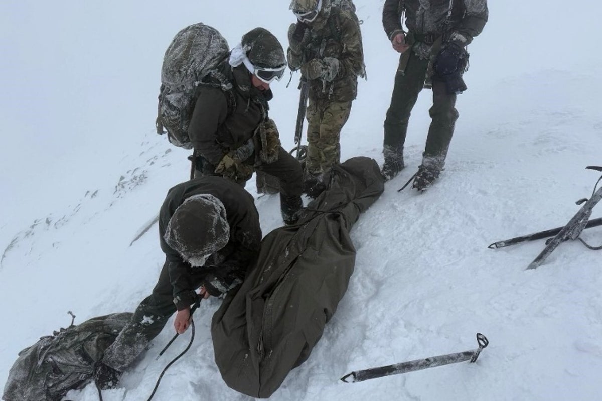 Climber found curled up on Ben Nevis in -20C blizzard rescued by Royal Marines during training exercise