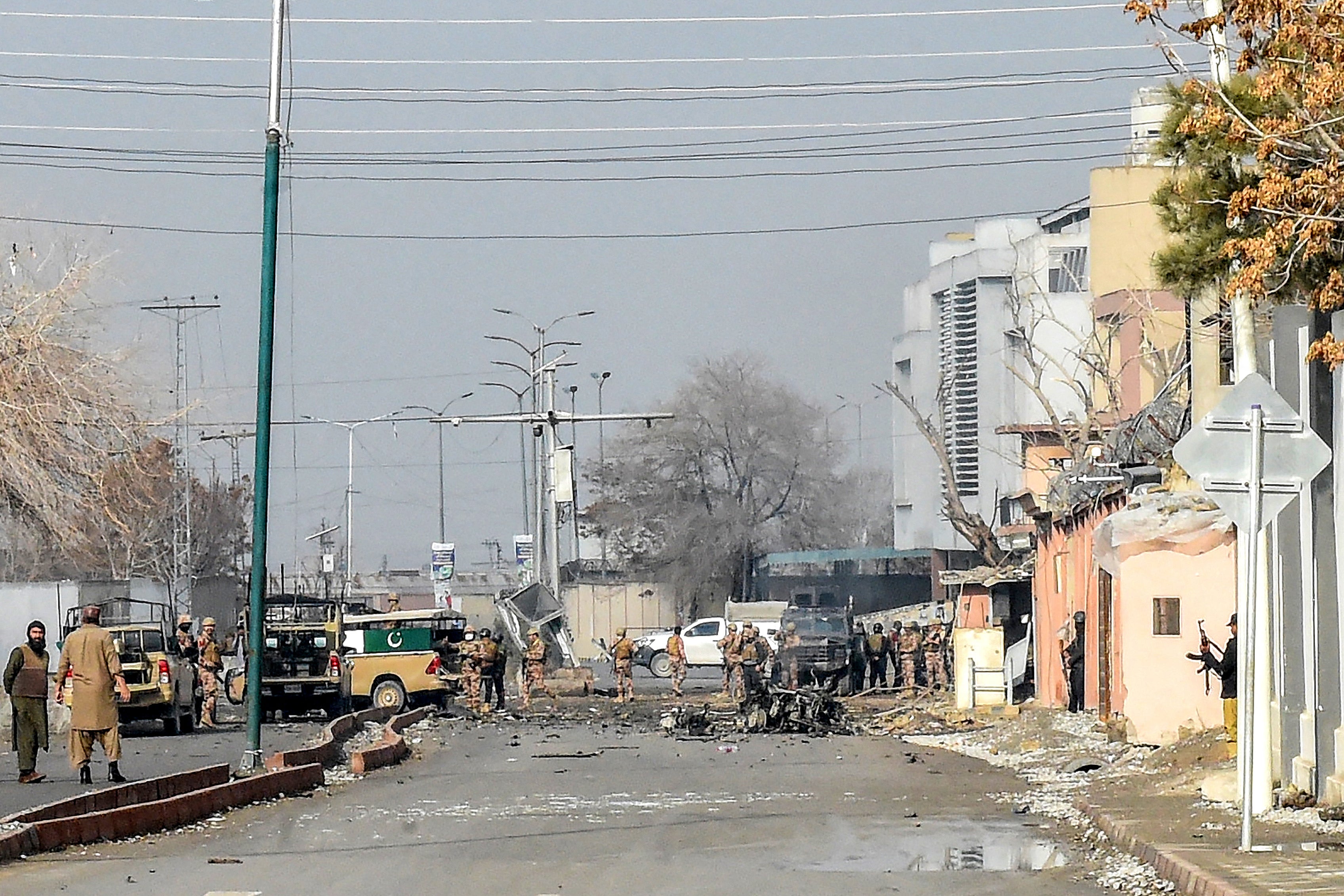 Security personnel inspect the blast site after an attack by Baloch separatists