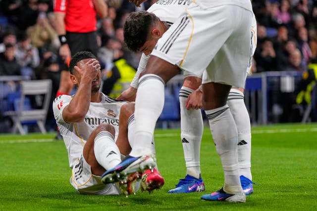 <p>Jude Bellingham lies on the pitch injured during Real Madrid’s game against Rayo Vallecano</p>