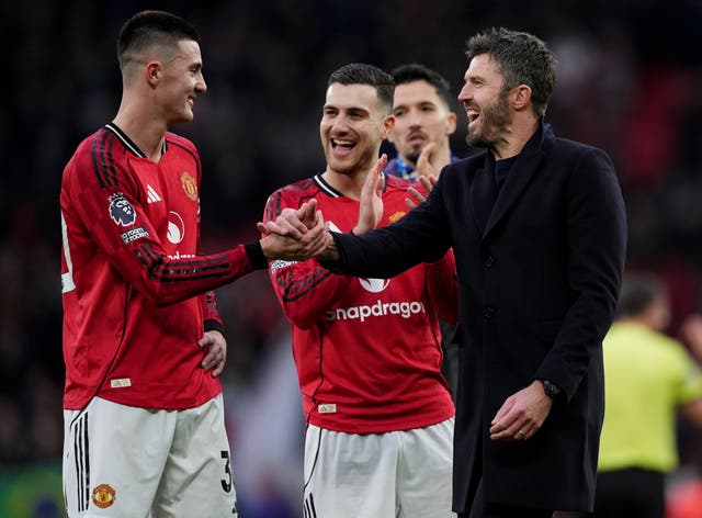<p>Interim head coach Michael Carrick (right) congratulates Benjamin Sesko at the end of the game (Martin Rickett/PA)</p>