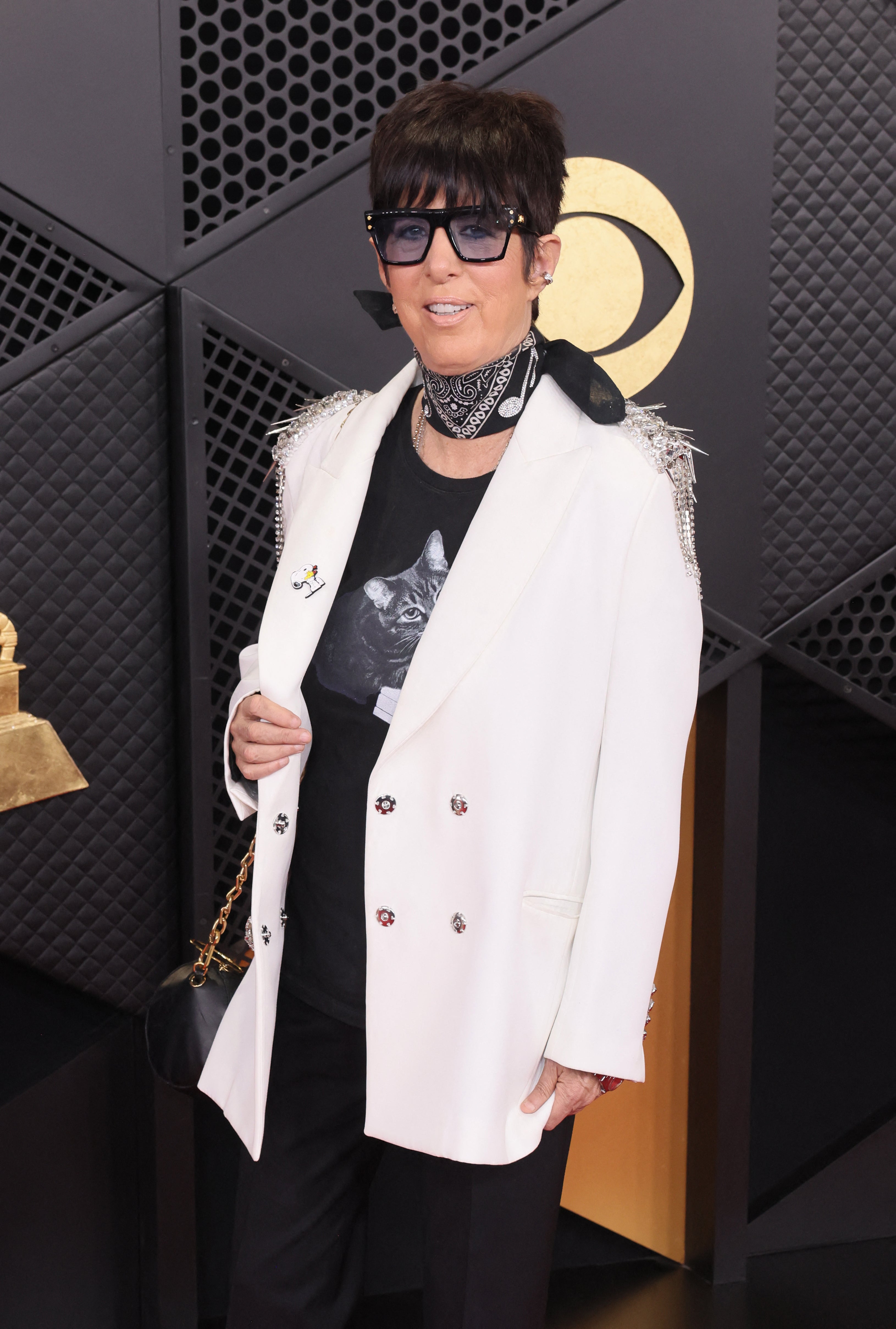 The ensemble also featured a white blazer and a black bandana with music notes on it in a nod to the evening