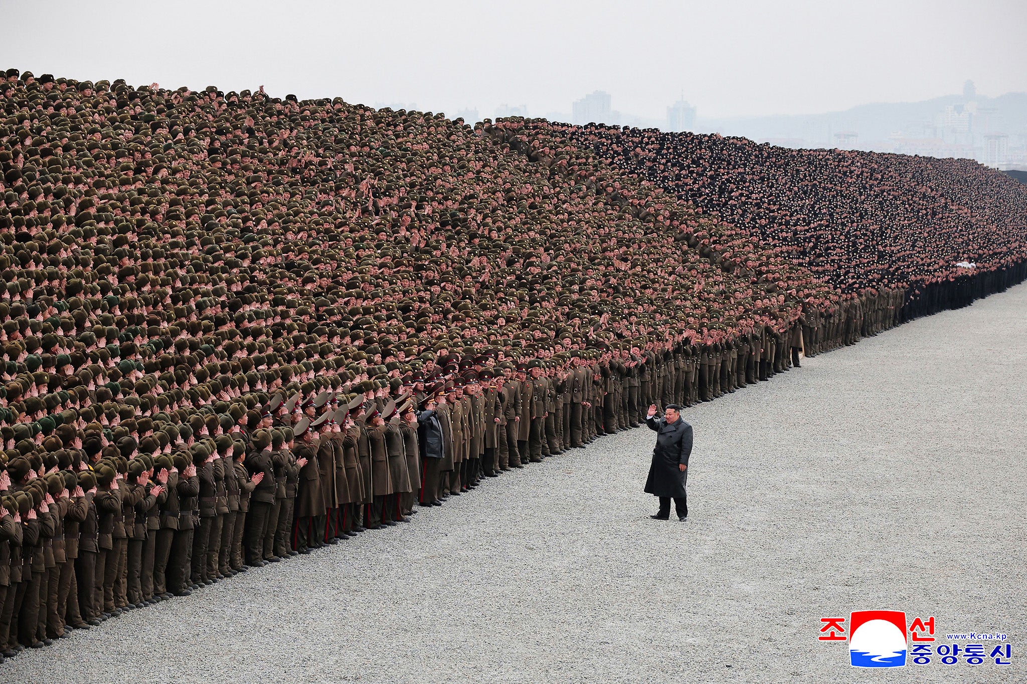 North Korean leader Kim Jong Un participates in a commemorative photo session with soldiers in North Pyongan Province, North Korea