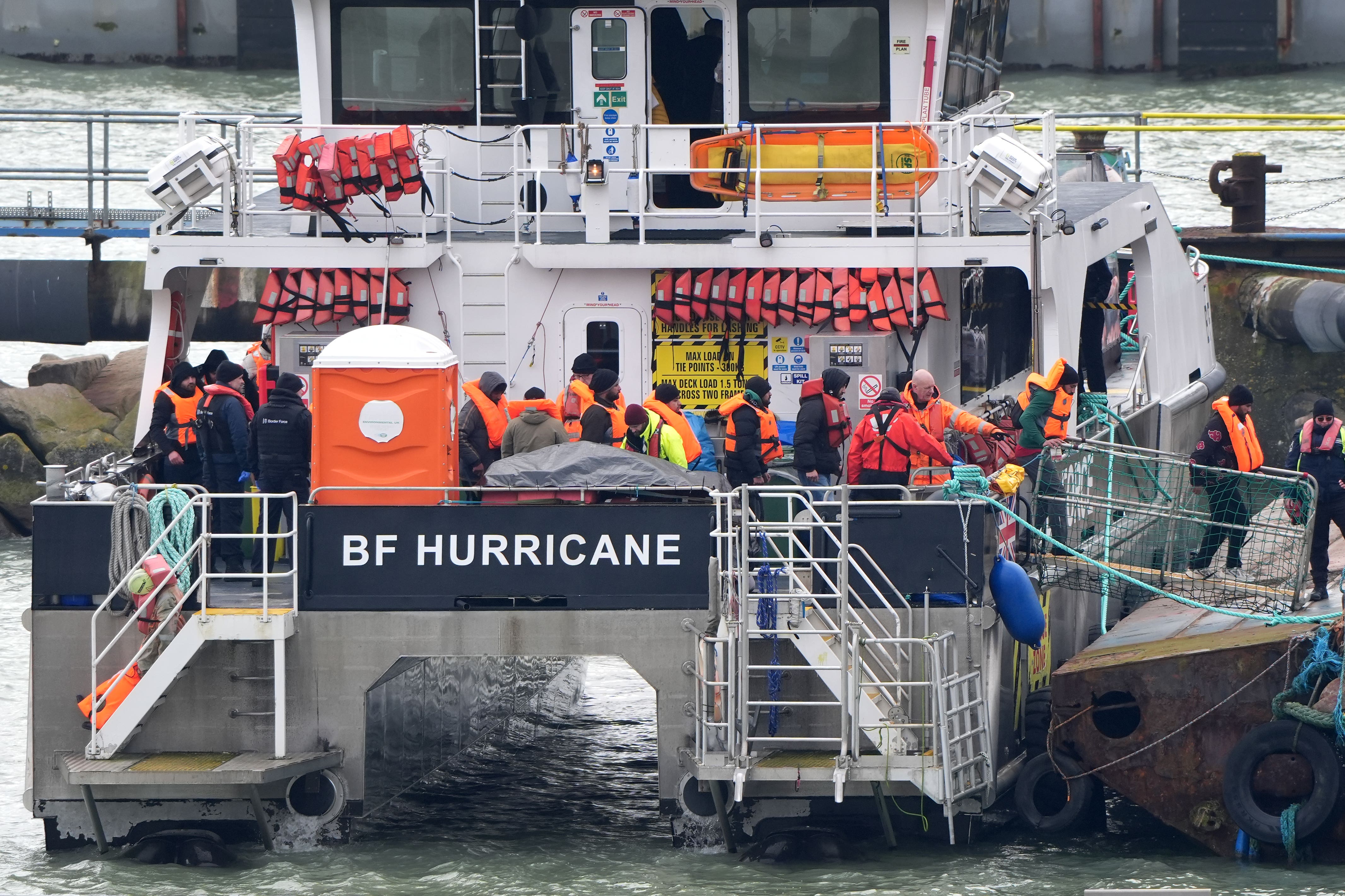 A group of people thought to be migrants are brought in to the Border Force compound in Ramsgate, Kent (Gareth Fuller/PA)