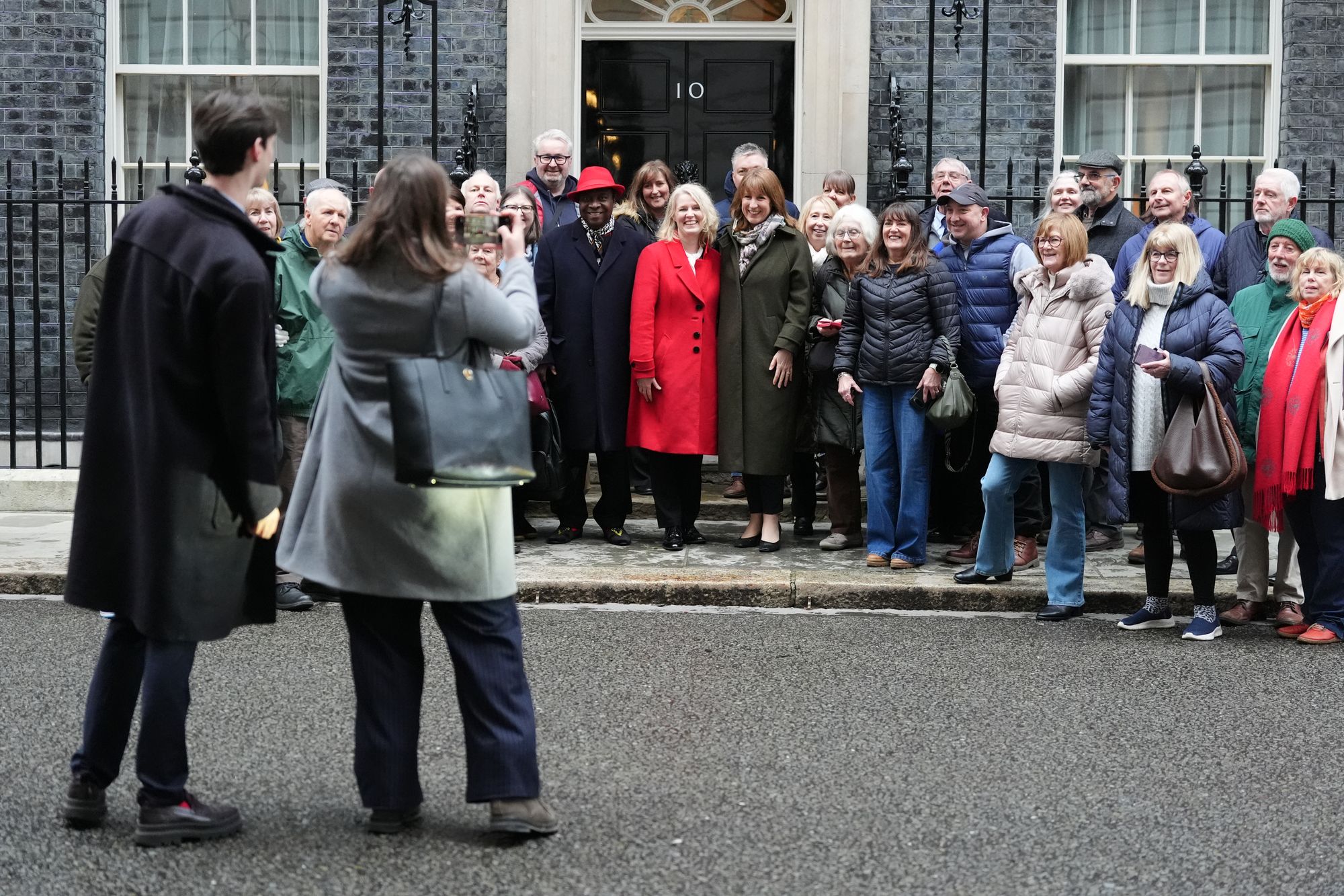 Jo White (centre, red) speaks out about the Mandelson review scandal