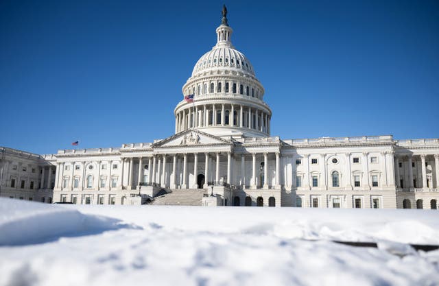 The US Capitol building is seen surrounded by snow