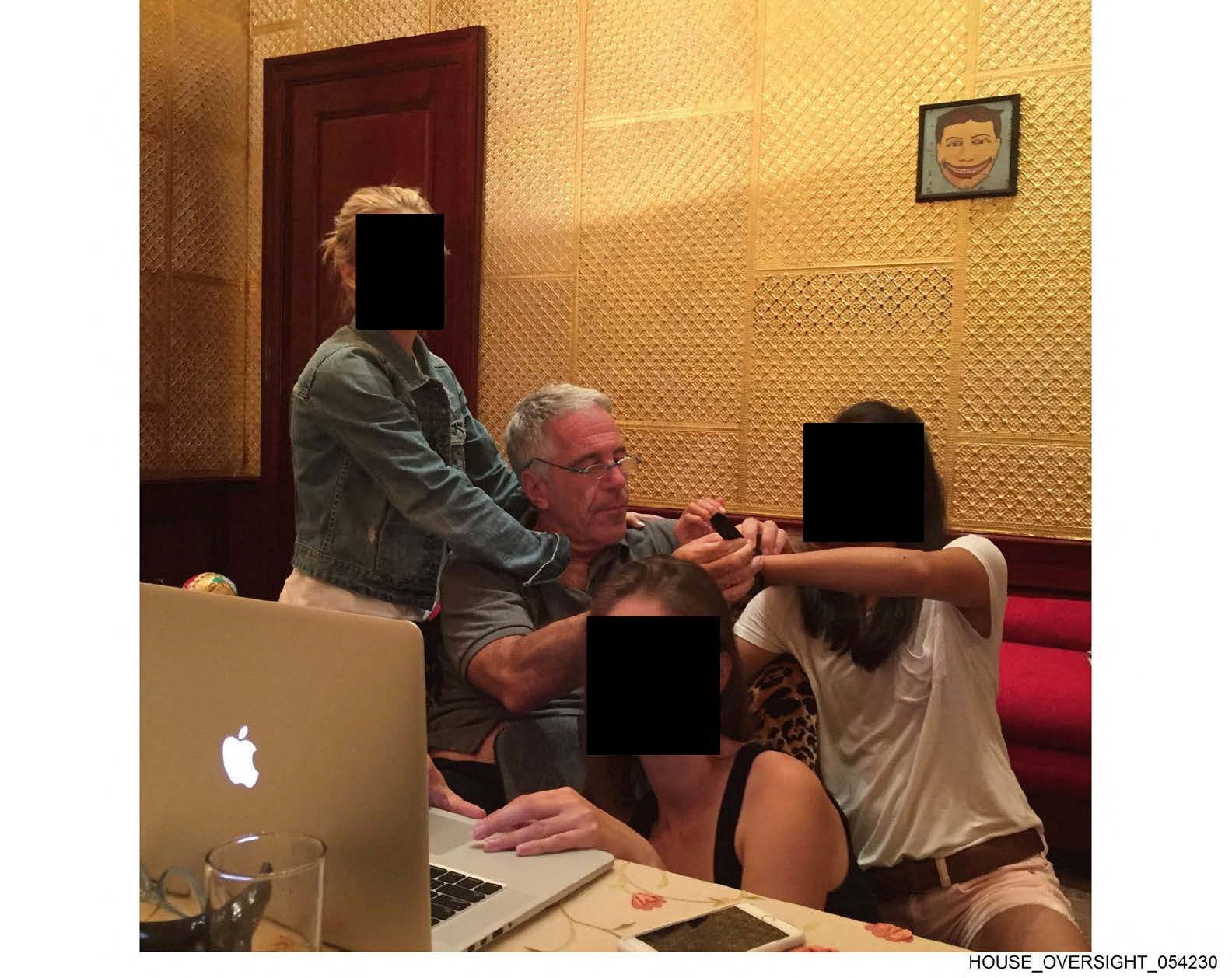 The convicted sex offender pictured with young women, whose identities have been obscured