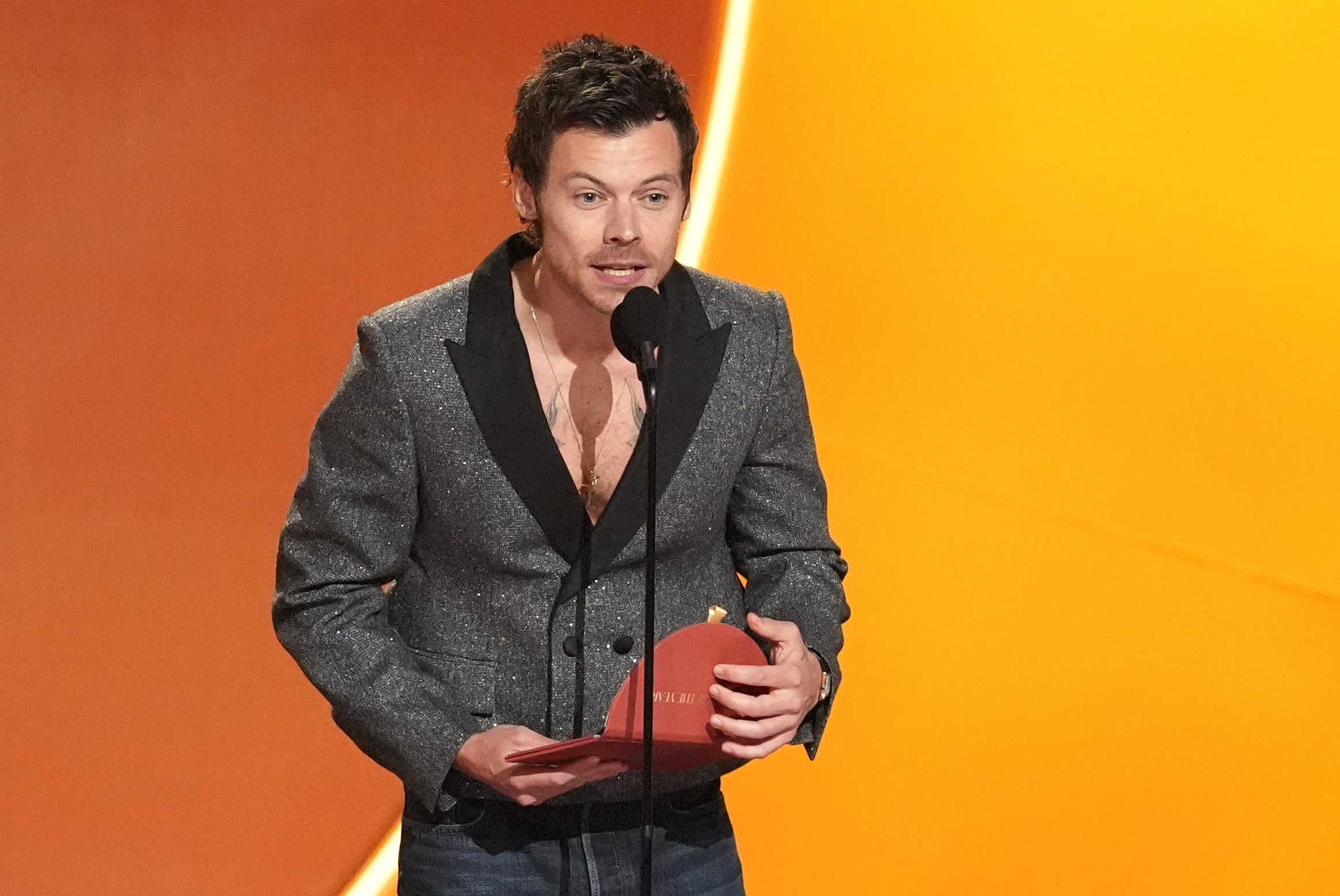 <p>Harry Styles presents the award for album of the year during the 68th annual Grammy Awards </p>