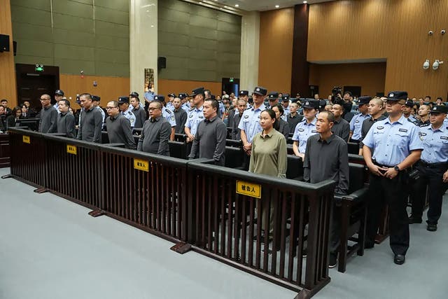 <p>File: Wenzhou Intermediate People's Court taken and released on 29 September 2025 shows members of the Ming family mafia organisation appearing in the Wenzhou Intermediate People's Court in China's eastern Zhejiang province, during their sentencing for crimes in relation to their involvement with scam compound</p>