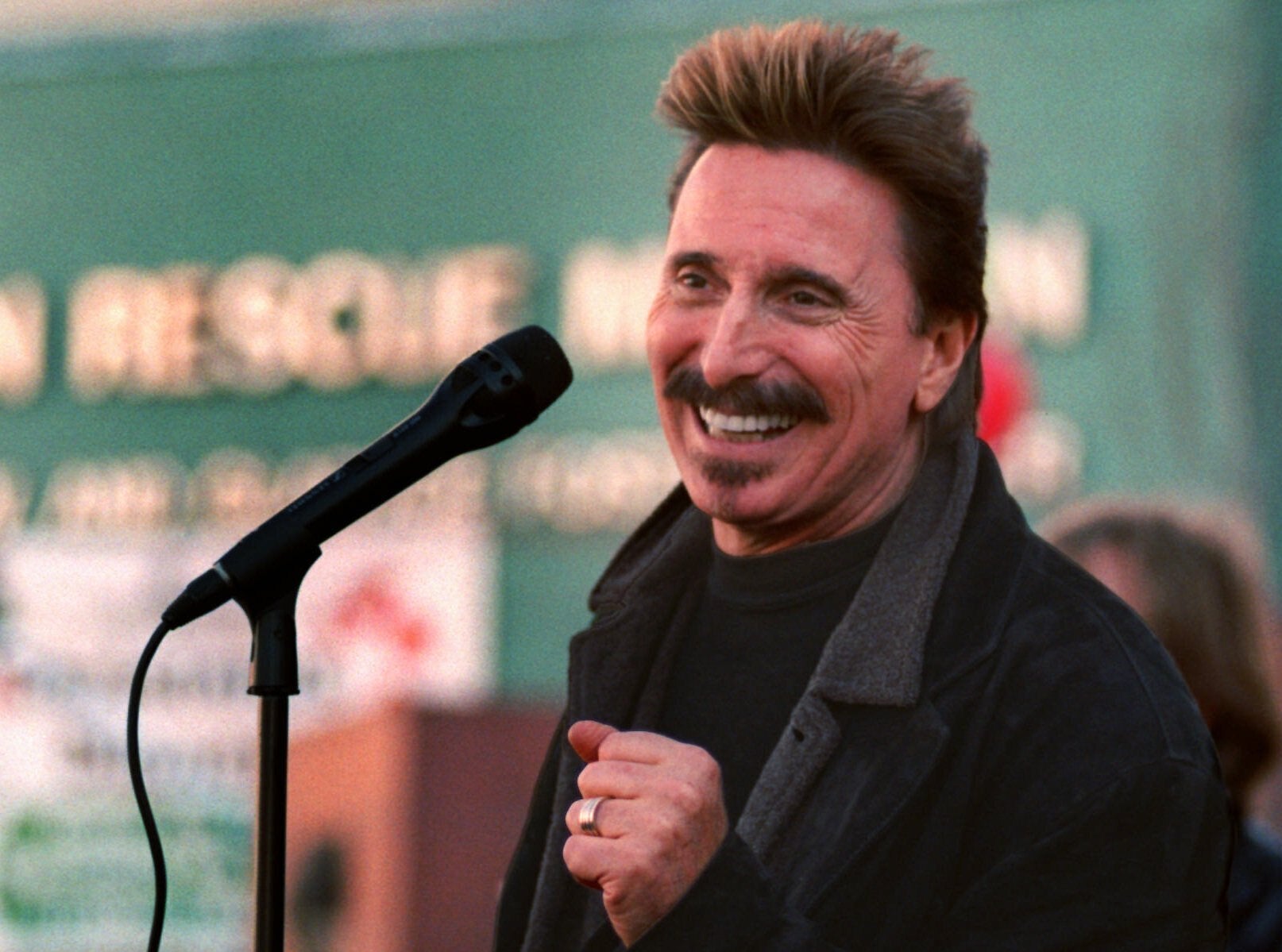 FILE - Chuck Negron, former lead singer of Three Dog Night, sings to a crowd during a Christmas Eve party in 1997