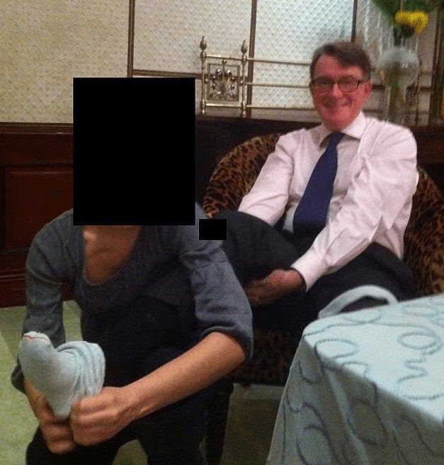 A new picturemerged of Mandelson having a foot rub