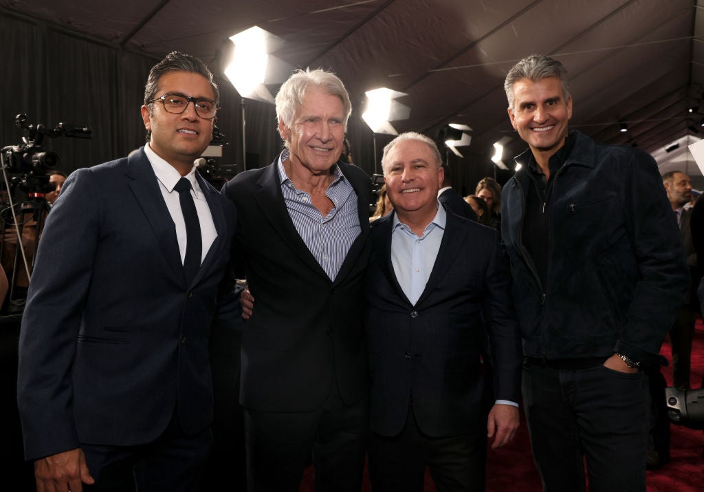 (L-R) Disney executive Asad Ayaz, Harrison Ford, Alan Bergman, Co-Chairman, Disney Entertainment, and Josh D'Amaro, Chairman, Disney Experiences, at TCL Chinese Theater in Hollywood, California on February 11, 2025