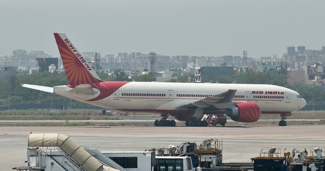 <p>An Air India plane is seen parked on the tarmac at the Indira Gandhi International Airport in New Delhi</p>