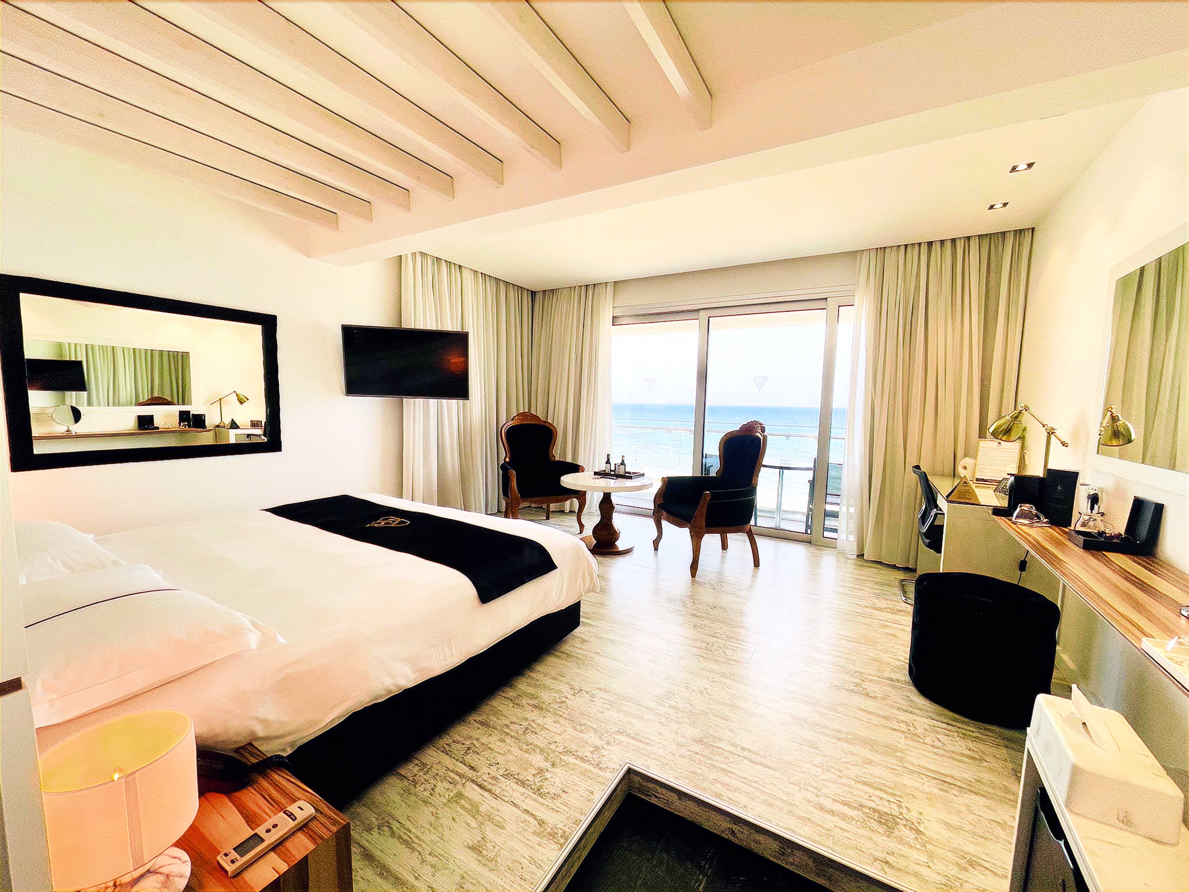 Look out over Mackenzie Beach at the Ciao Stelio Deluxe Hotel