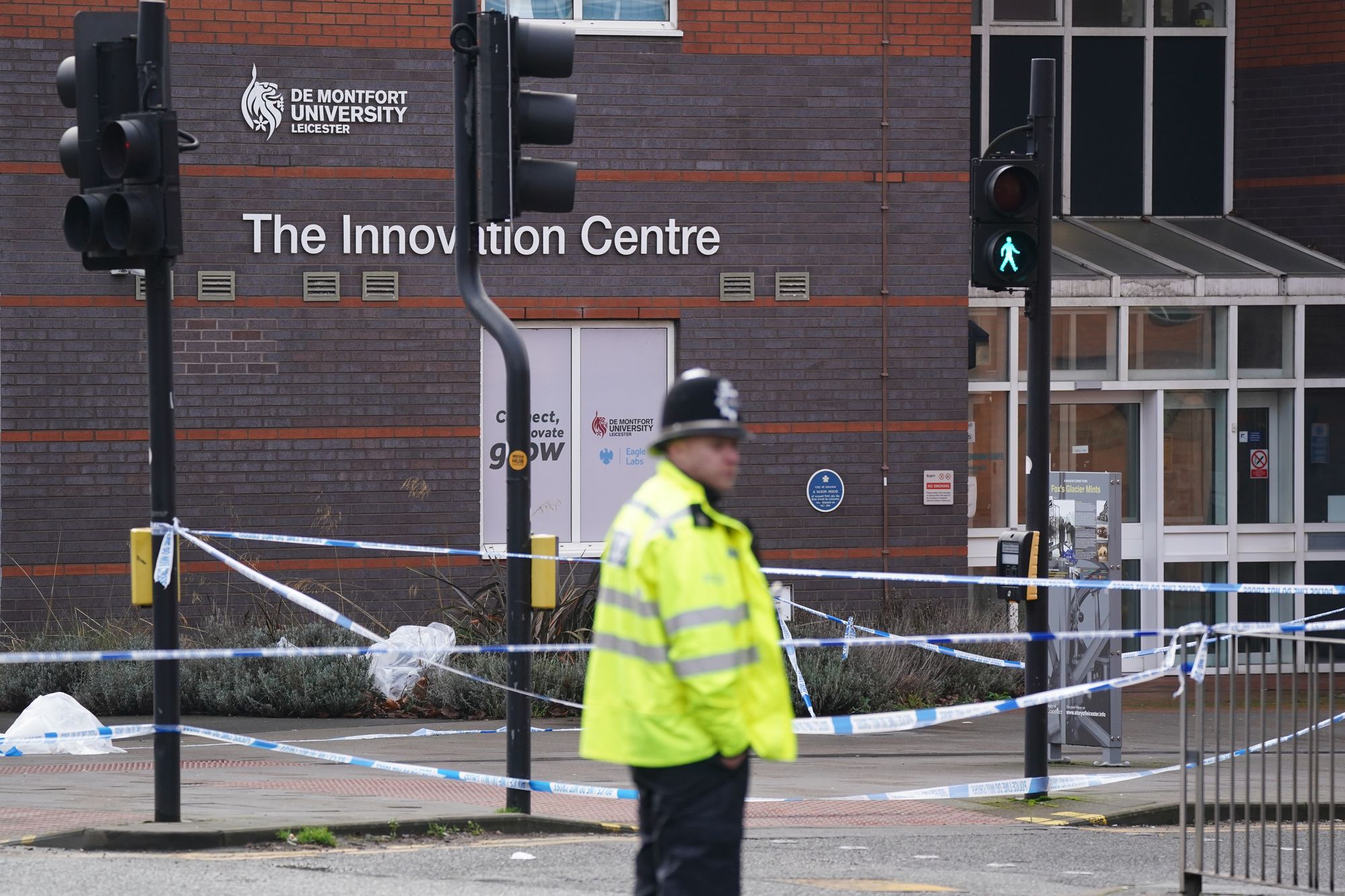 Police at the scene at the campus of De Montfort University in Leicester, after an 18-year-old man was arrested on suspicion of murder