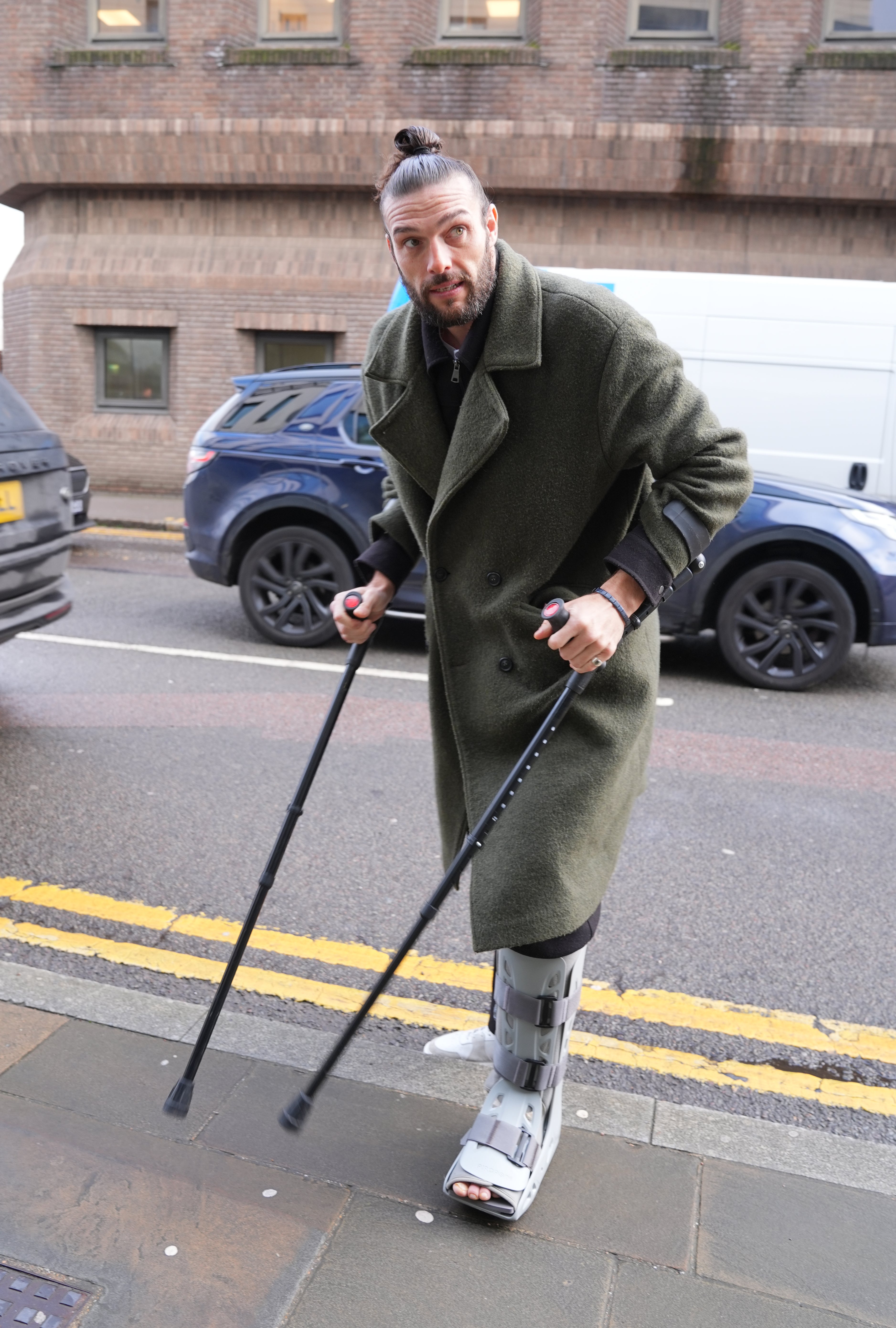 The footballer arrived at Chelmsford Magistrates’ Court in crutches and a leg brace