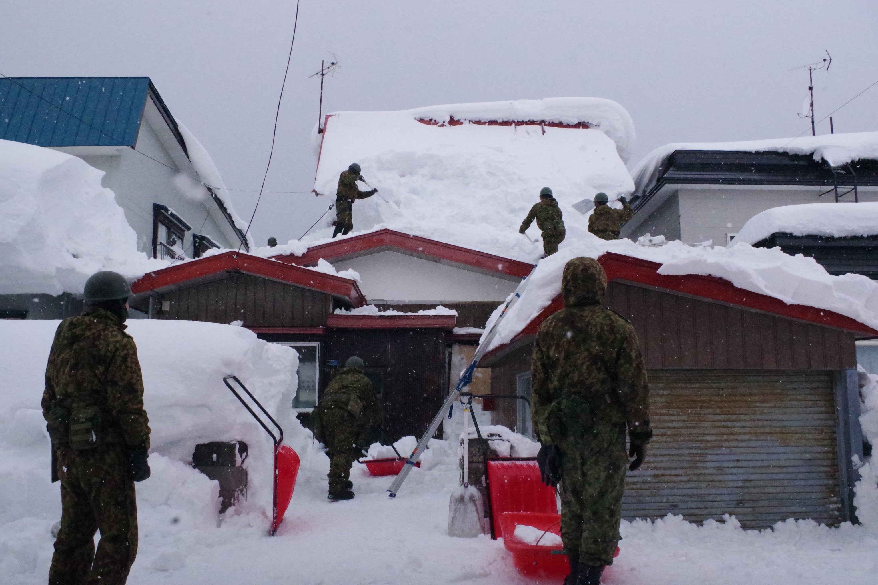 Japanese soldiers carry out snow removal work in Aomori prefecture