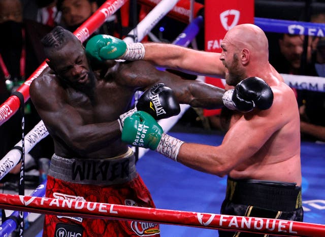 <p>Deontay Wilder (left) and Tyson Fury during their trilogy fight in 2021</p>