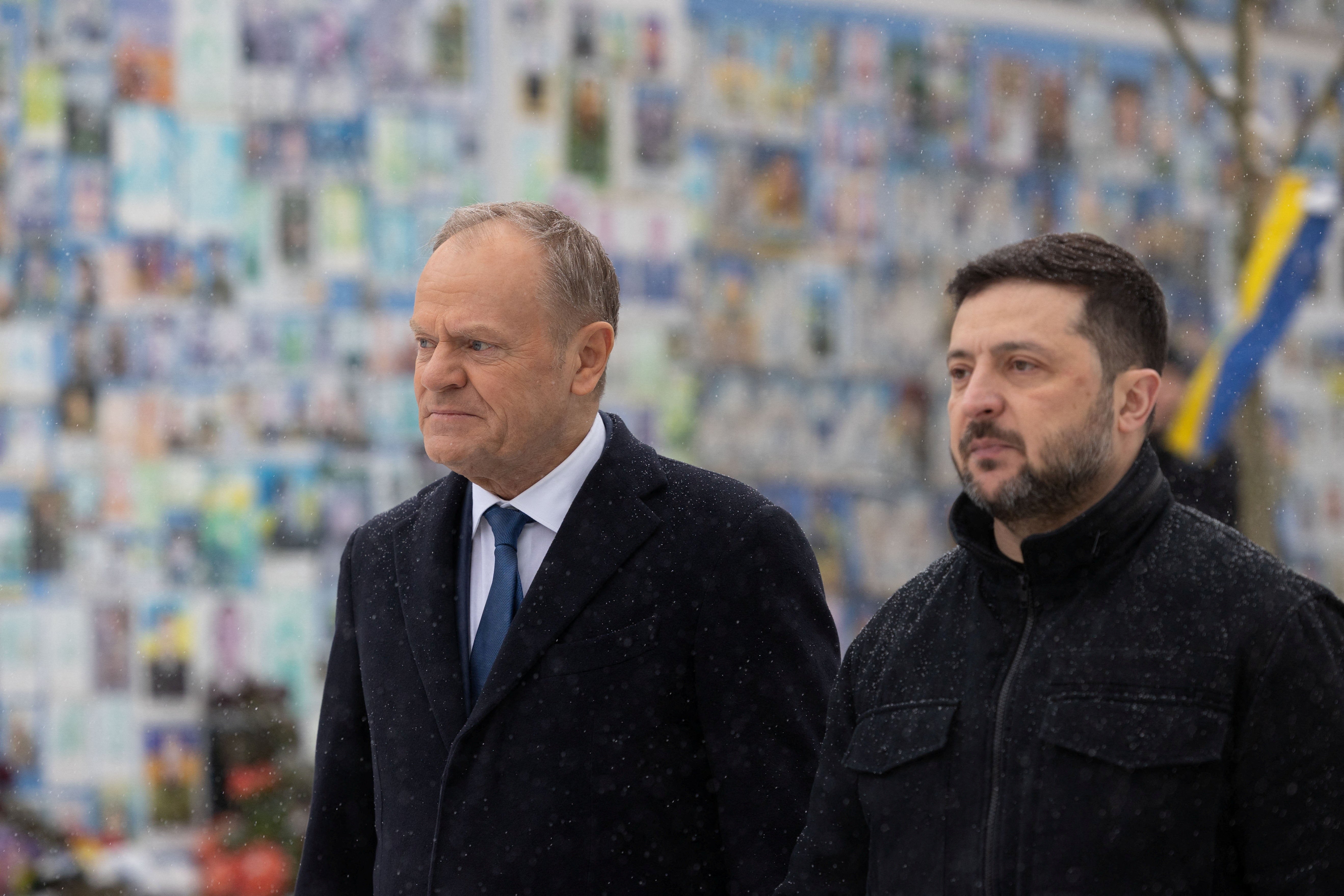 Ukraine's president Volodymyr Zelensky and Polish prime minister Donald Tusk visit the Wall of Remembrance of the Fallen for Ukraine outside the Saint Michael's Cathedral in Kyiv