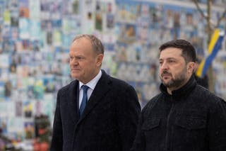 Ukraine's president Volodymyr Zelensky and Polish prime minister Donald Tusk visit the Wall of Remembrance of the Fallen for Ukraine outside the Saint Michael's Cathedral in Kyiv