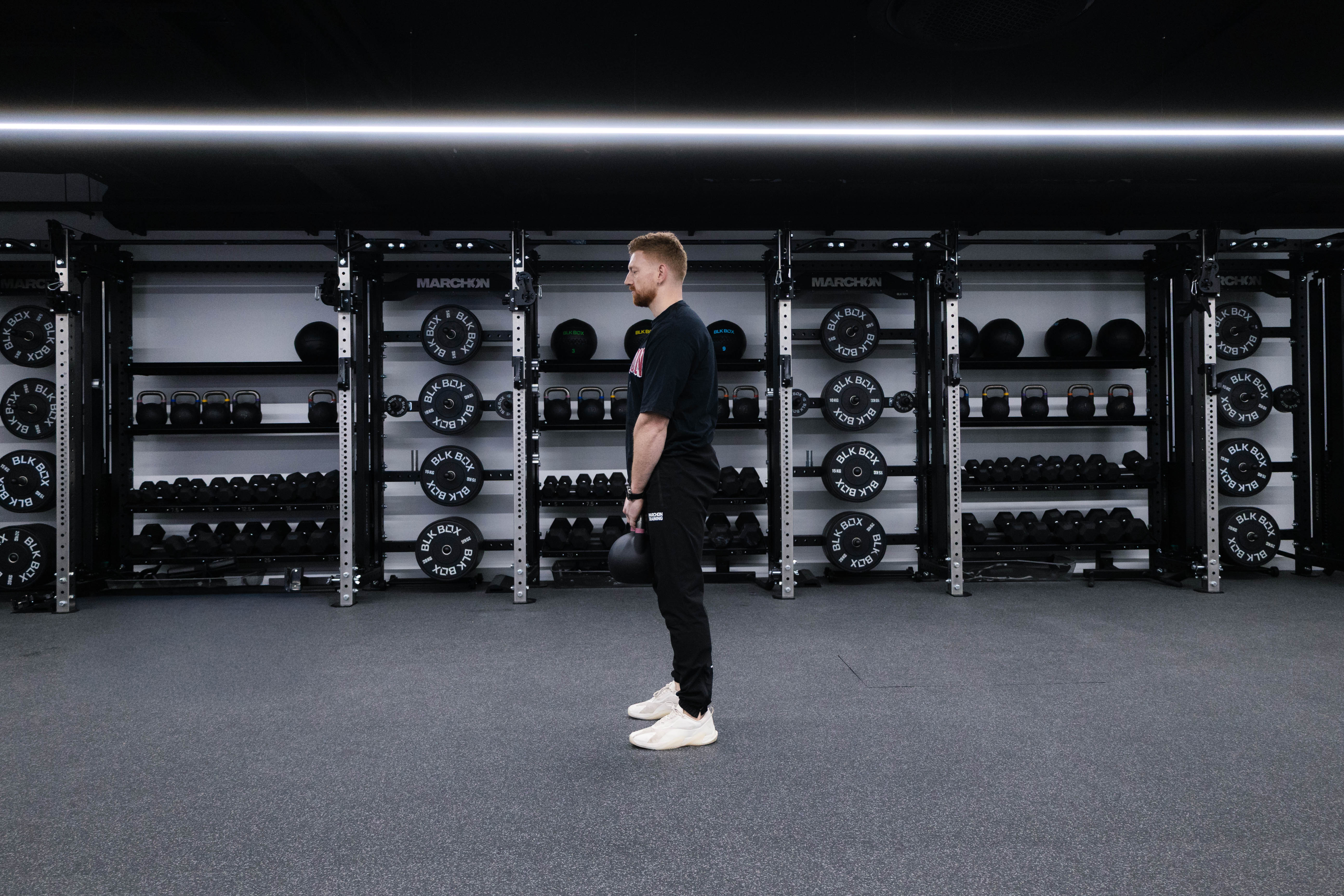 Marchon coach Patrick James demonstrating a Romanian deadlift