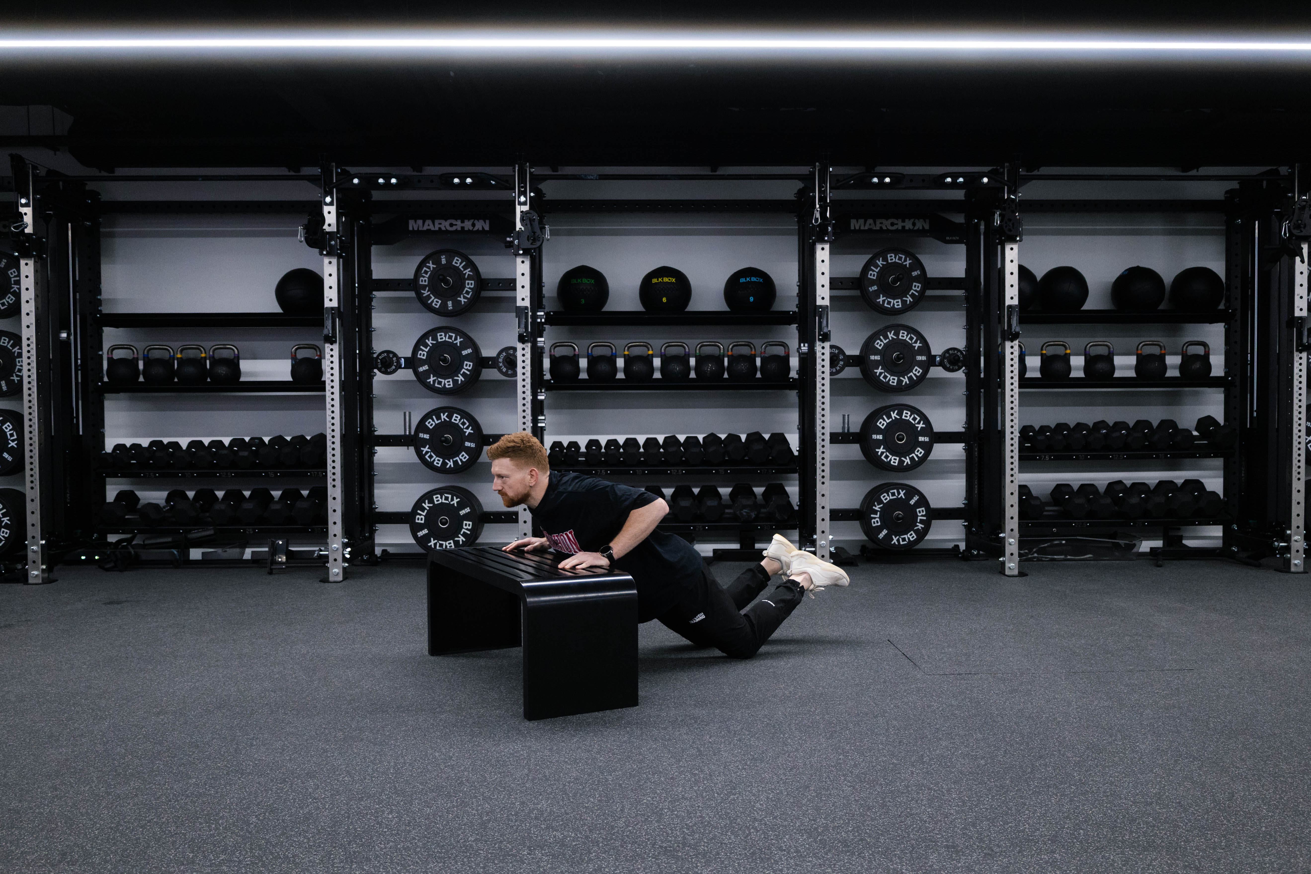 Marchon coach Patrick James demonstrating a kneeling hands-elevated press-up
