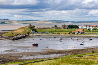 <p>Located 60 miles north of Newcastle, the island is accessible by a causeway just twice daily</p>