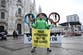Greenpeace stages Winter Olympics protest as torch arrives in Milan