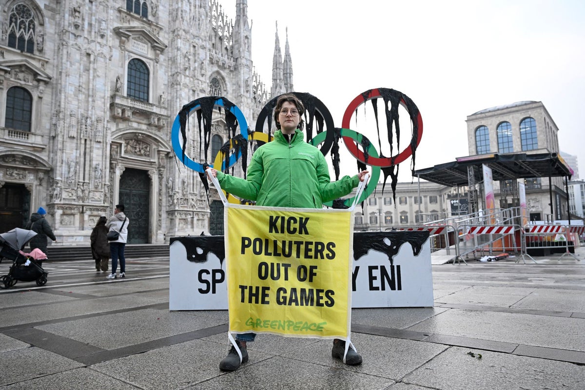 Greenpeace stages Winter Olympics protest as torch arrives in Milan Greenpeace stages Winter Olympics protest as torch arrives in Milan